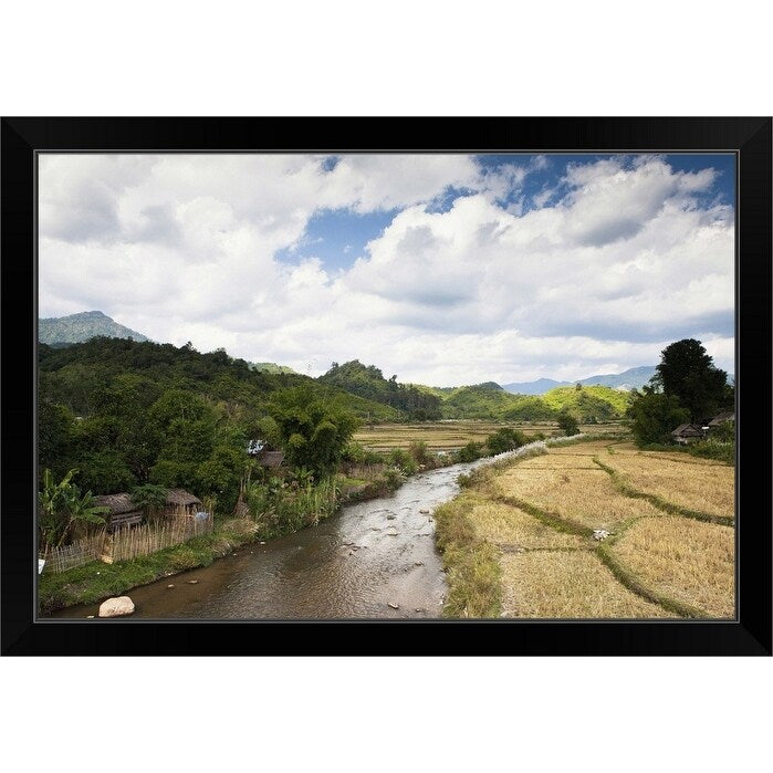 "A countryside river flowing through rice fields" Black Framed Print