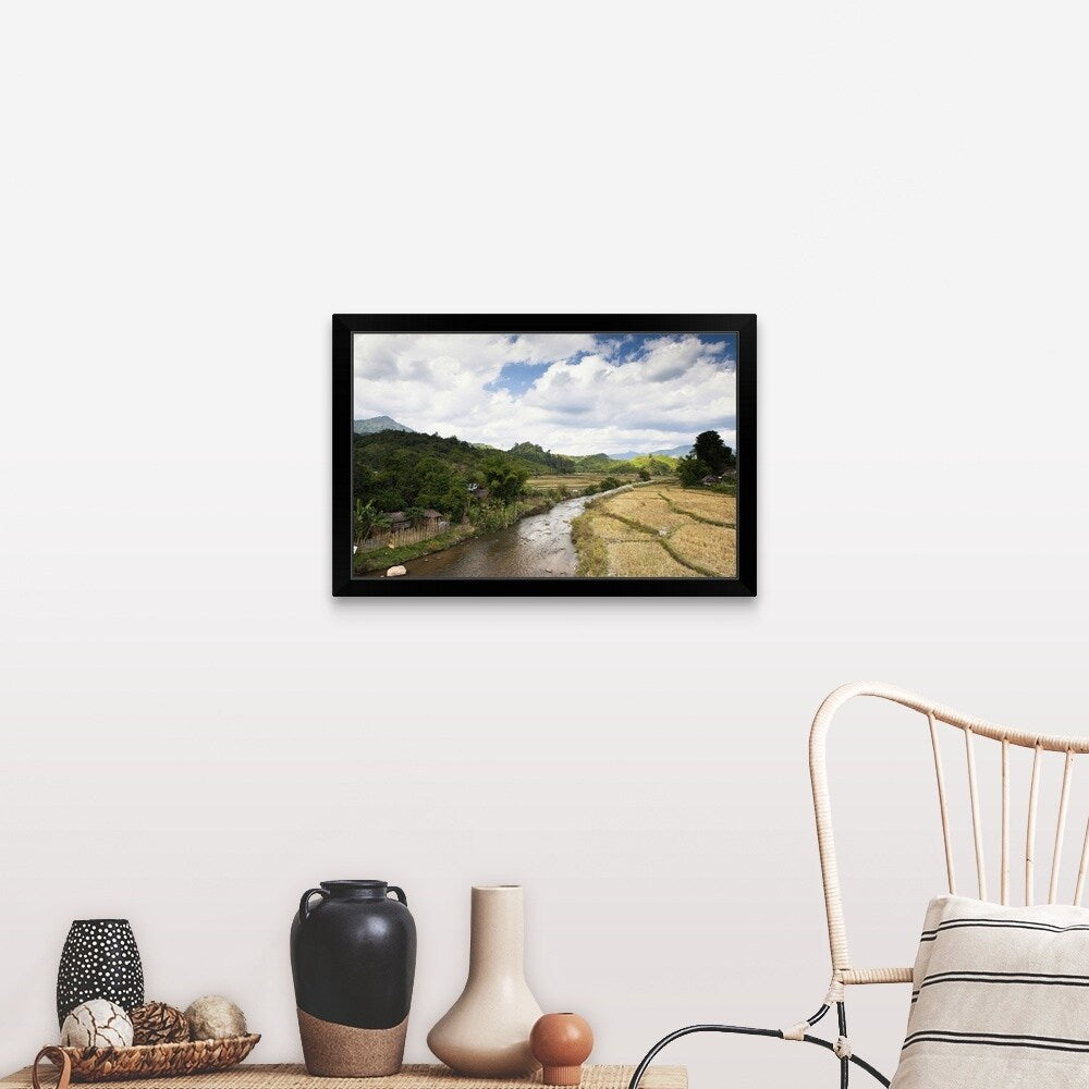 "A countryside river flowing through rice fields" Black Framed Print