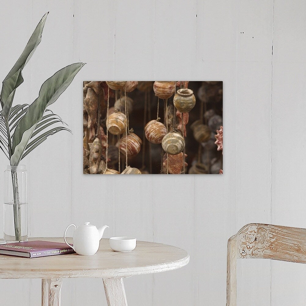 "Clay fish and pottery hanging" Canvas Wall Art