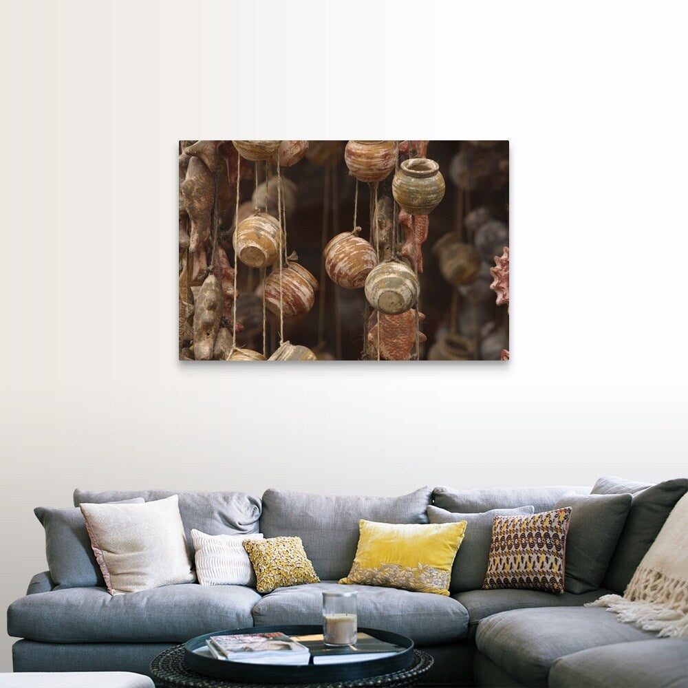 "Clay fish and pottery hanging" Canvas Wall Art