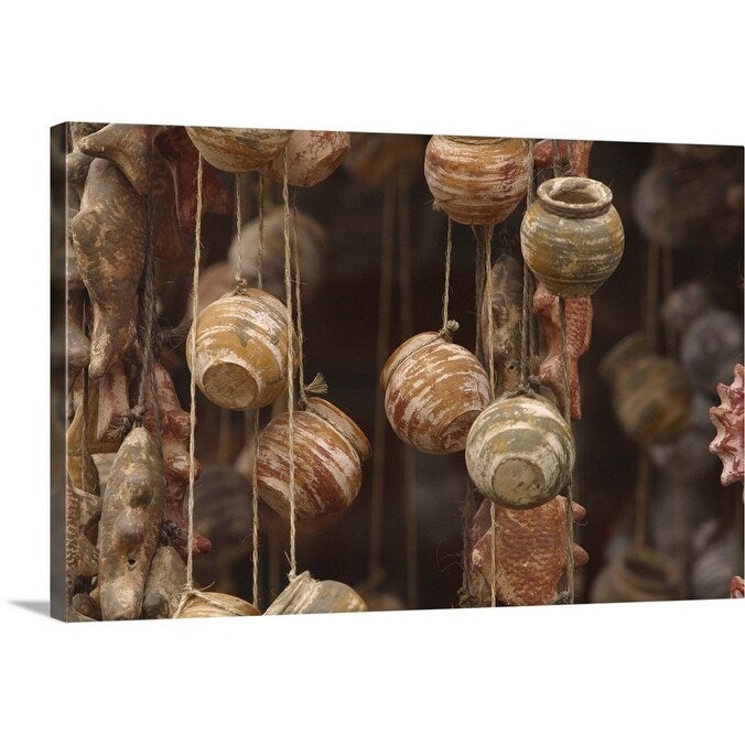 "Clay fish and pottery hanging" Canvas Wall Art
