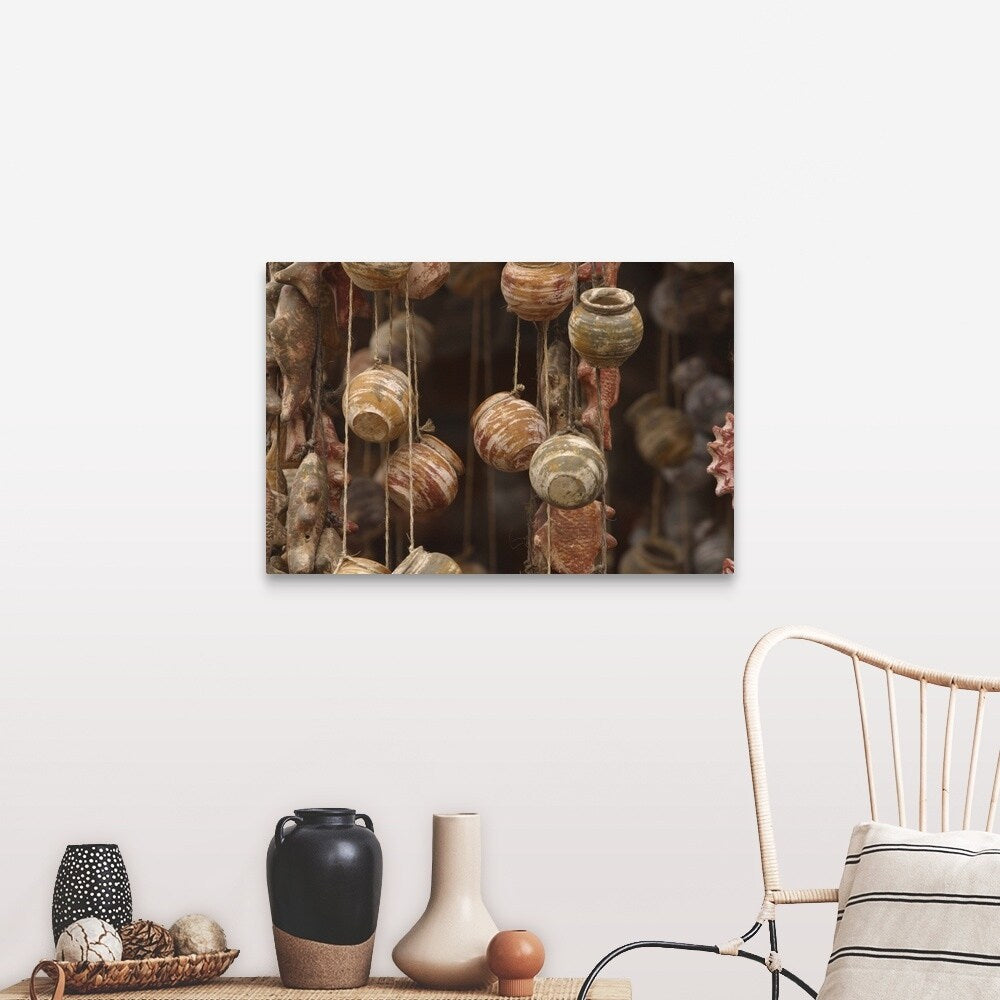 "Clay fish and pottery hanging" Canvas Wall Art