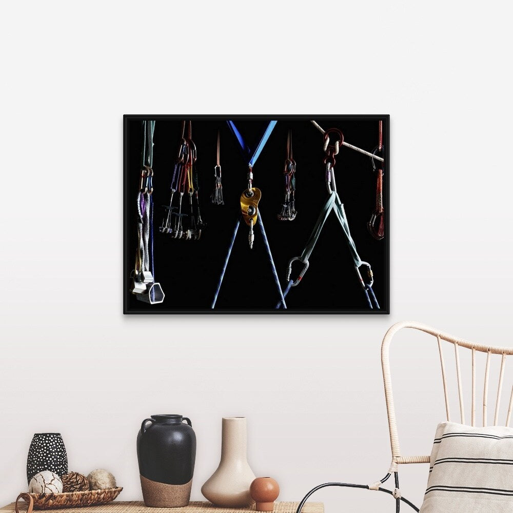 "Climbing equipment on black background" Black Float Frame Canvas Art
