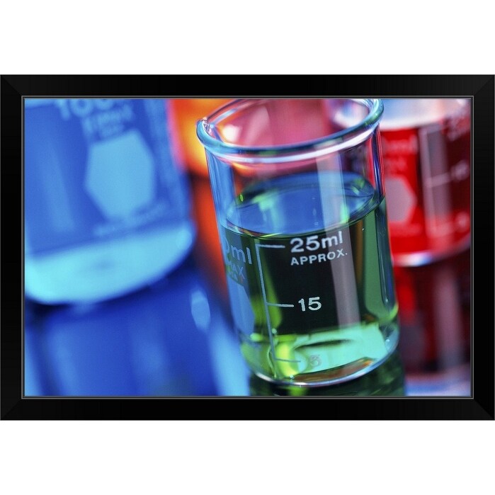 "Close-up of beakers containing colored liquid" Black Framed Print