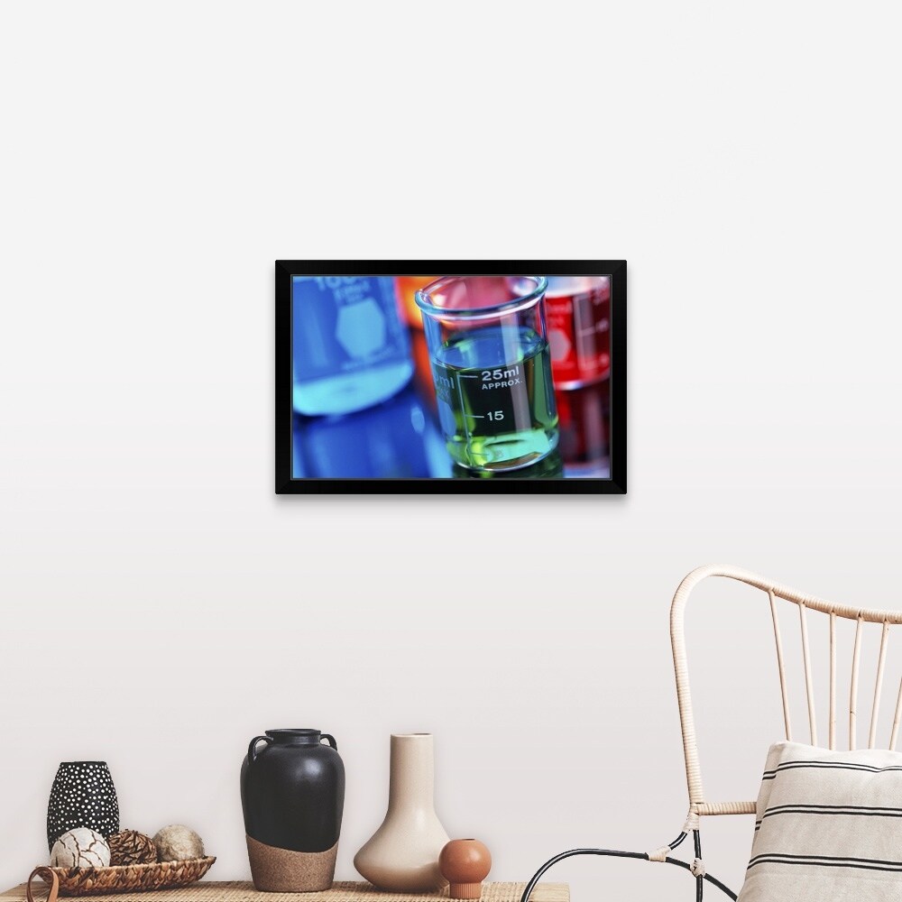 "Close-up of beakers containing colored liquid" Black Framed Print