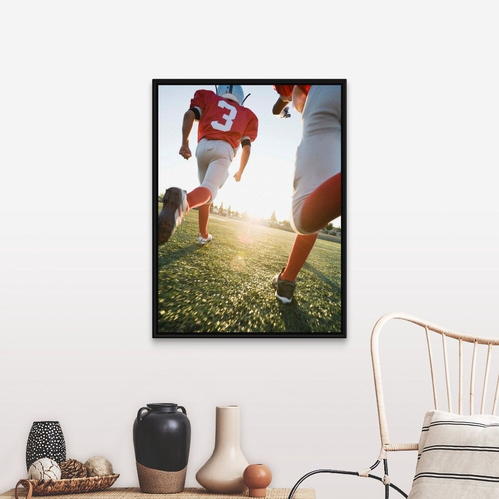 "Football players running on field" Black Float Frame Canvas Art