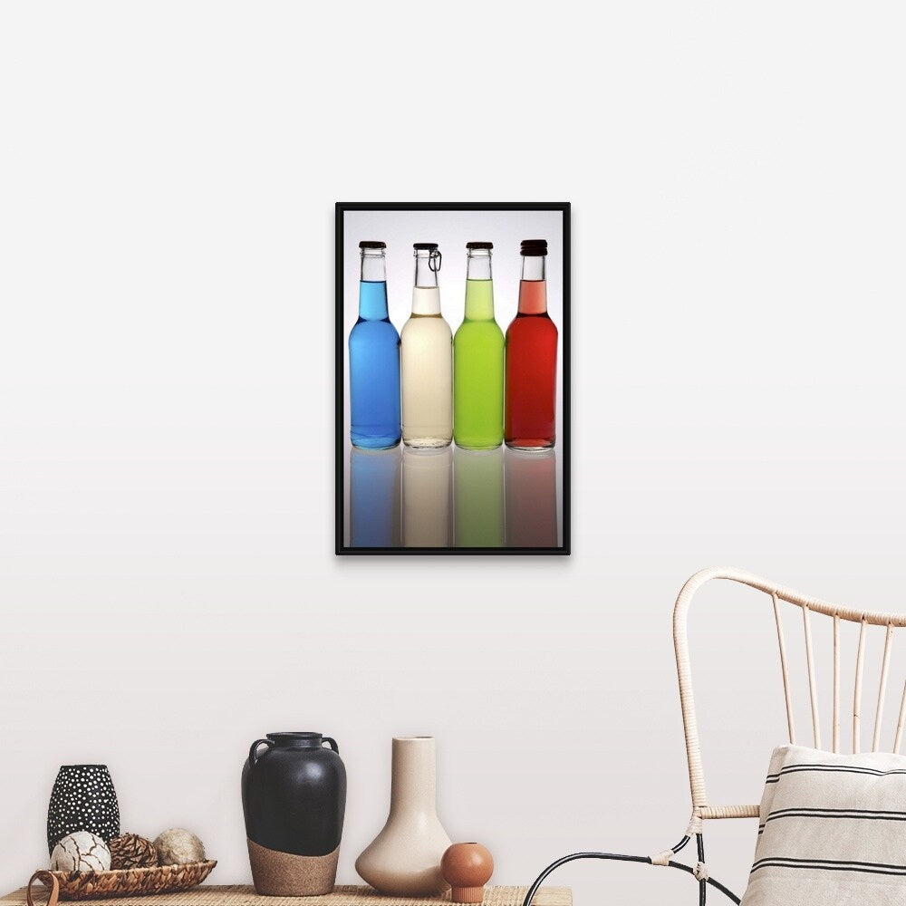 "Four cocktails in glass bottles, lined up in a row" Black Float Frame Canvas Art