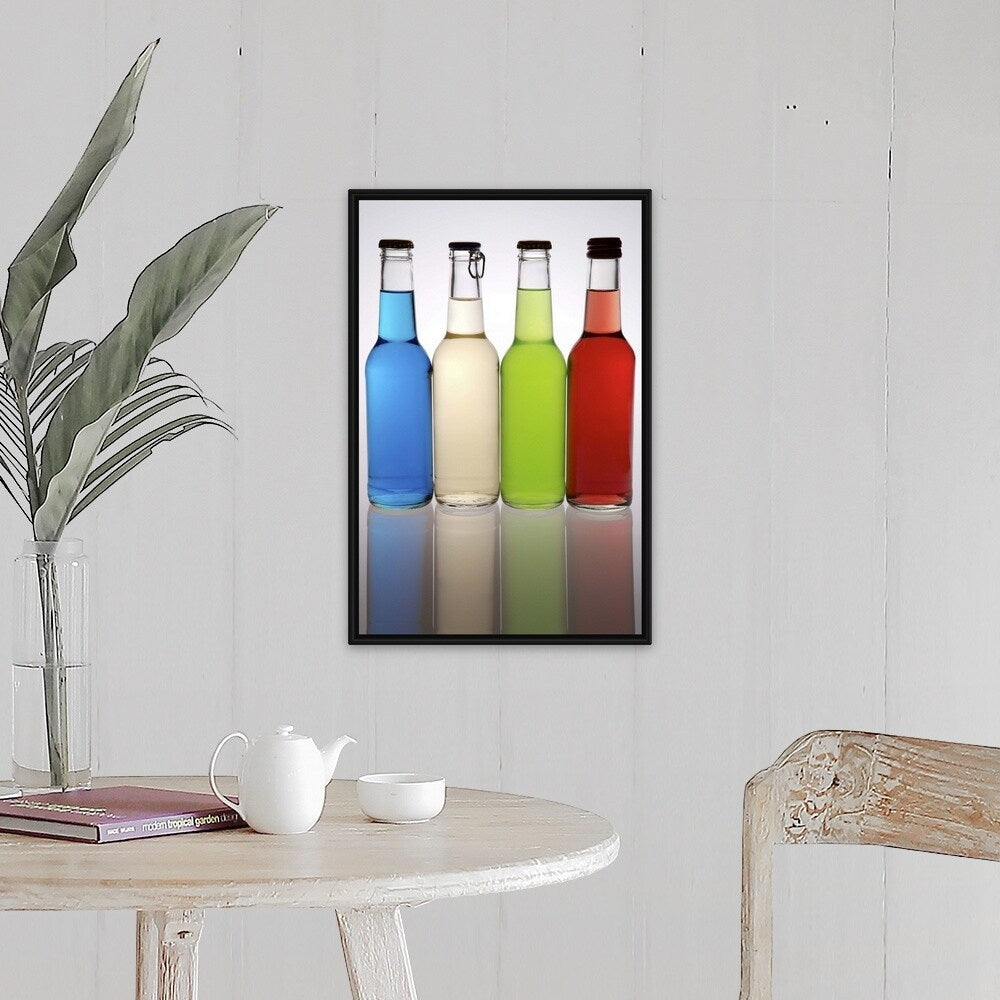 "Four cocktails in glass bottles, lined up in a row" Black Float Frame Canvas Art