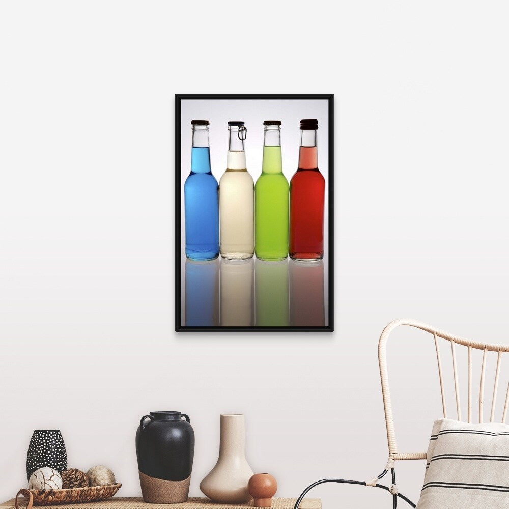 "Four cocktails in glass bottles, lined up in a row" Black Float Frame Canvas Art