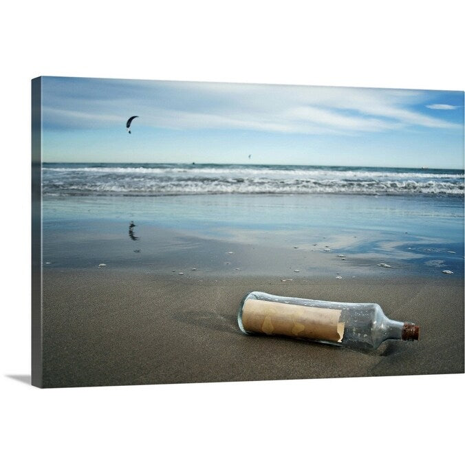 "Message in bottle on beach, with reflection on sand an blue sky in background." Canvas Wall Art