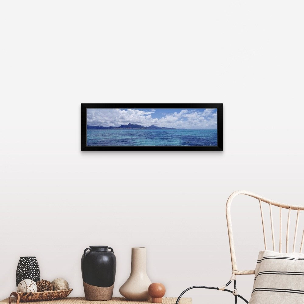 "Ocean with mountains in the background Mauritius" Black Framed Print