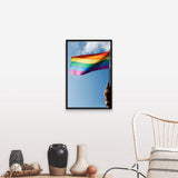 "Person's hand holding rainbow-colored flag waving in the sky" Black Float Frame Canvas Art