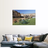 "Ponte Vecchio and table along Arno River" Poster Print - Multi