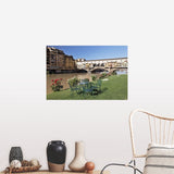 "Ponte Vecchio and table along Arno River" Poster Print - Multi