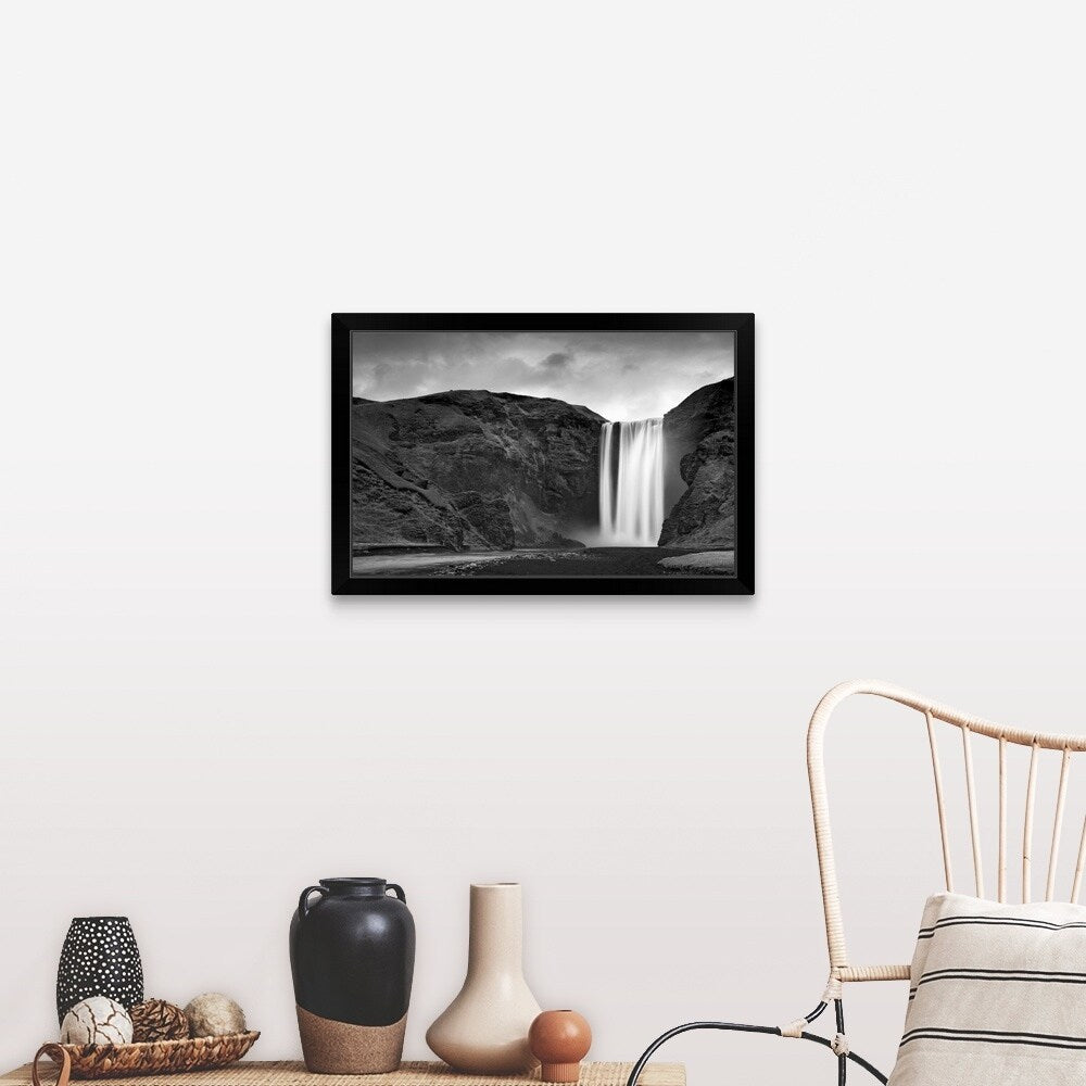 "Skogafoss waterfall plunges over old sea cliffs on south coast of Iceland." Black Framed Print