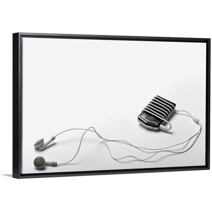 "Studio shot of mp3 player and earphones" Black Float Frame Canvas Art