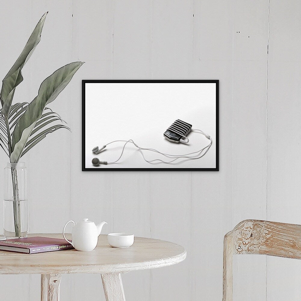"Studio shot of mp3 player and earphones" Black Float Frame Canvas Art