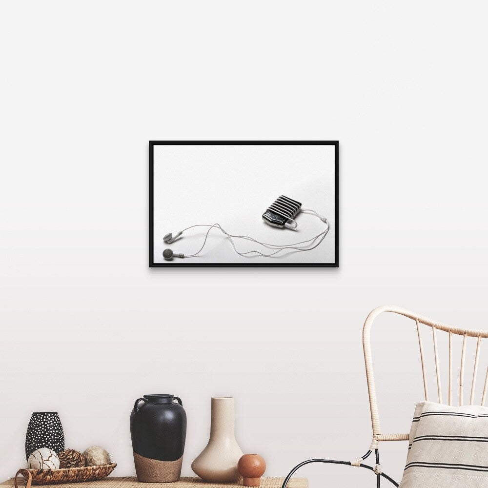 "Studio shot of mp3 player and earphones" Black Float Frame Canvas Art