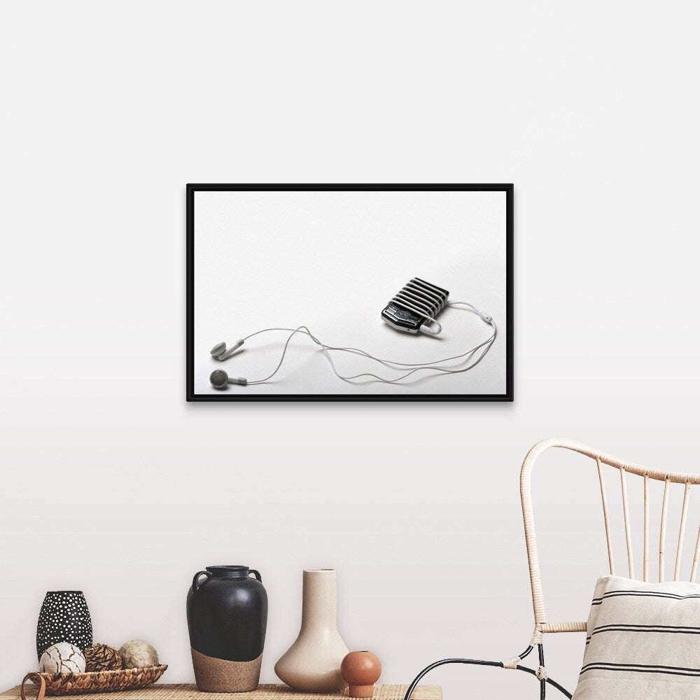 "Studio shot of mp3 player and earphones" Black Float Frame Canvas Art