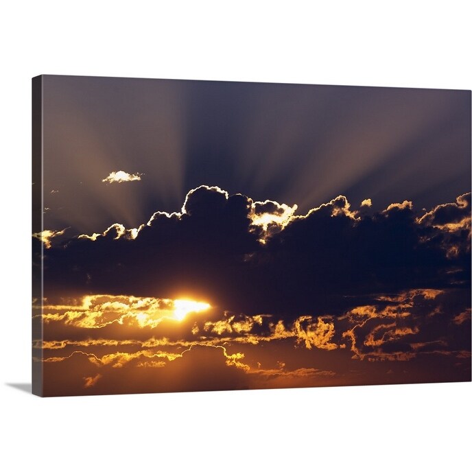 "Sun rising behind dark clouds, Montana" Canvas Wall Art