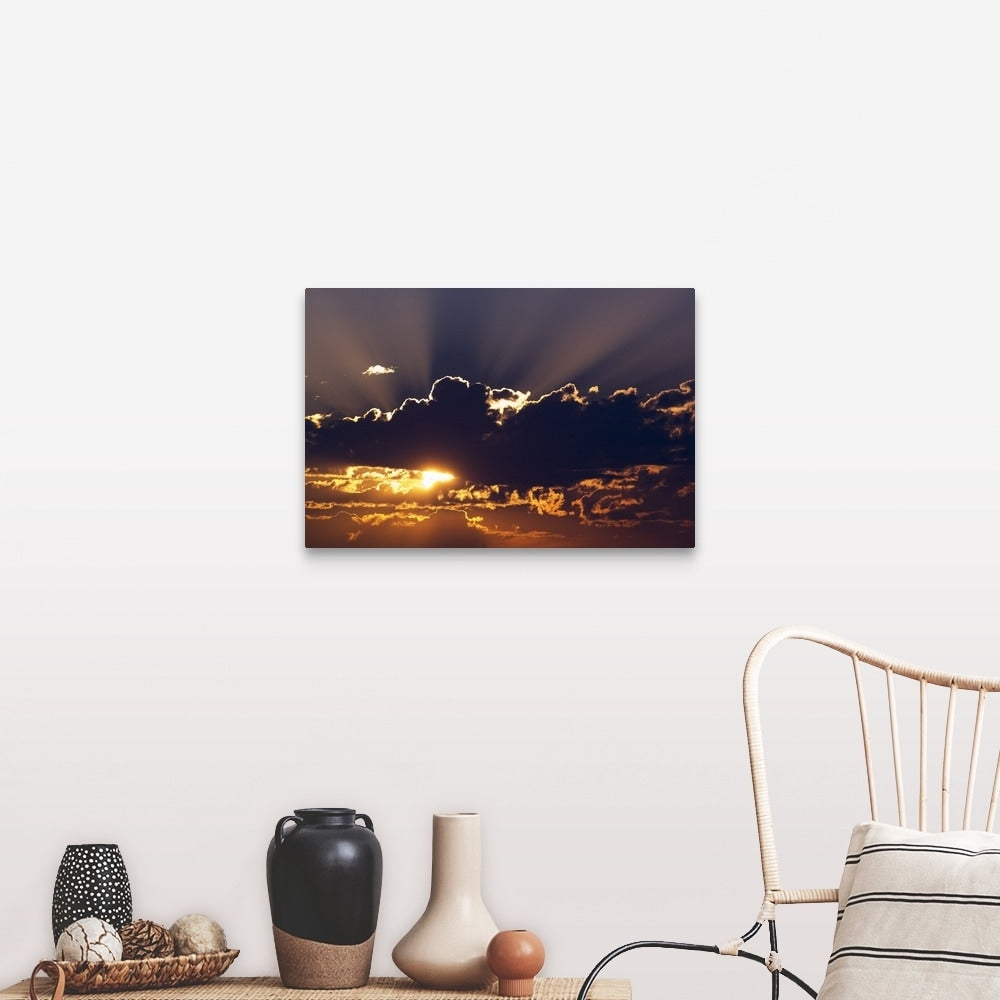 "Sun rising behind dark clouds, Montana" Canvas Wall Art