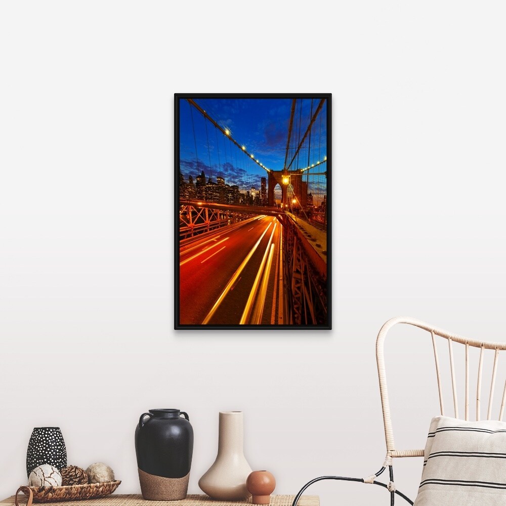 "USA, New York City, Brooklyn Bridge with light trails at dusk" Black Float Frame Canvas Art