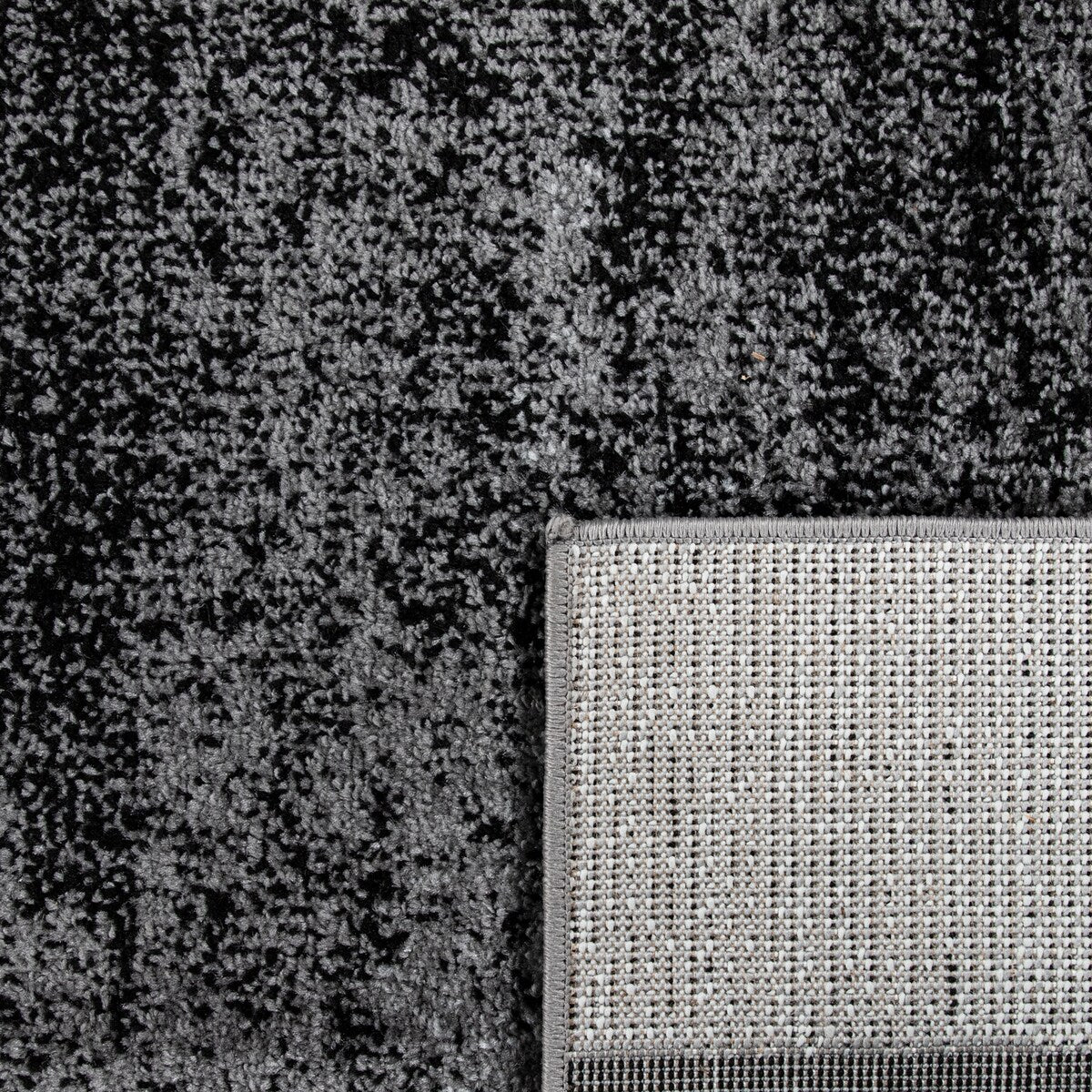 Black White Area Rug with Geometric Pattern and Modern Paint Effect