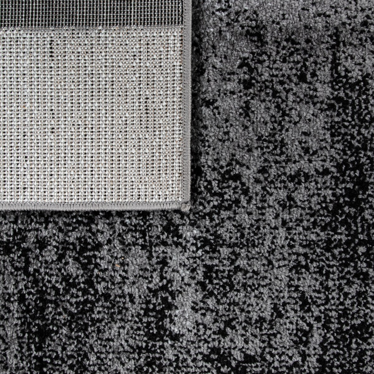 Black White Area Rug with Geometric Pattern and Modern Paint Effect