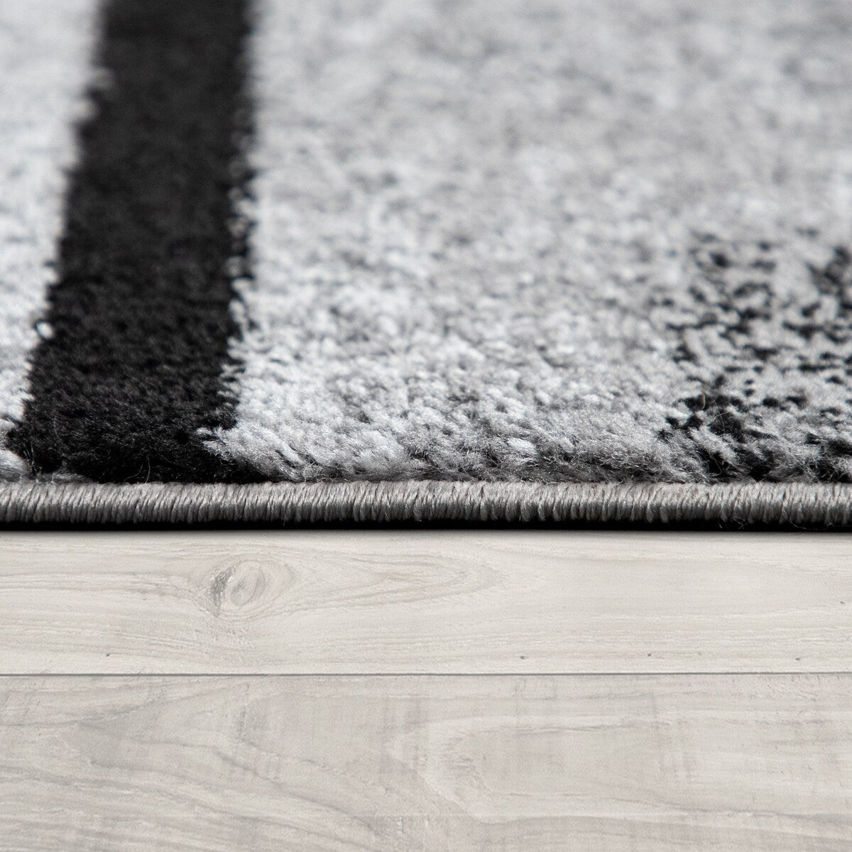 Black White Area Rug with Geometric Pattern and Modern Paint Effect