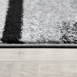 Black White Area Rug with Geometric Pattern and Modern Paint Effect