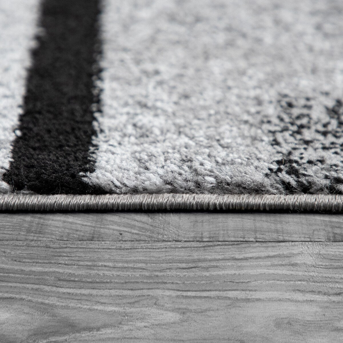 Black White Area Rug with Geometric Pattern and Modern Paint Effect
