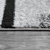 Black White Area Rug with Geometric Pattern and Modern Paint Effect
