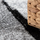 Black White Area Rug with Geometric Pattern and Modern Paint Effect
