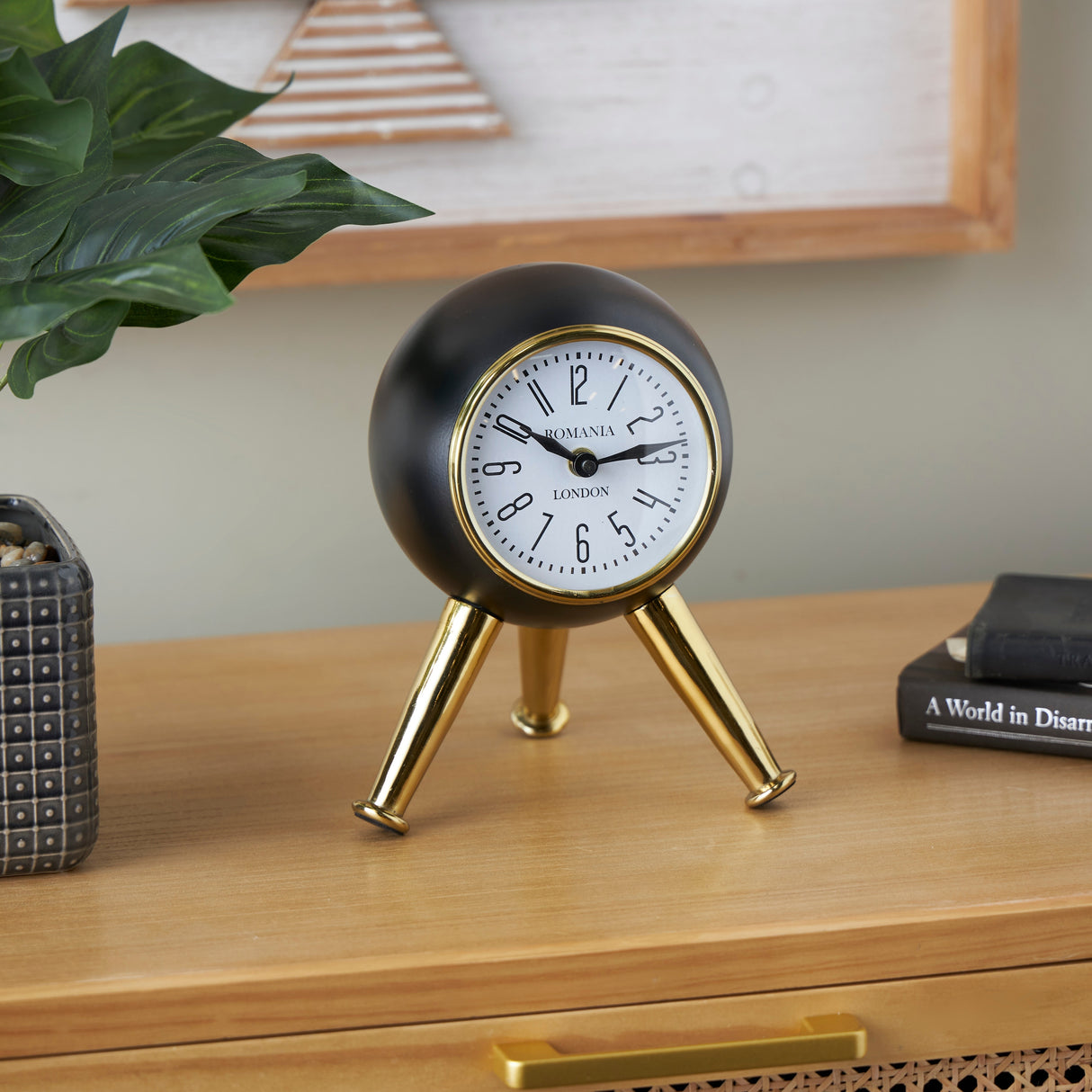 Black or Silver Metal Orb Tabletop Clock with White Clockface and Gold Tripod Legs