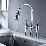 Bridge kitchen faucet with bridge pulldown spray
