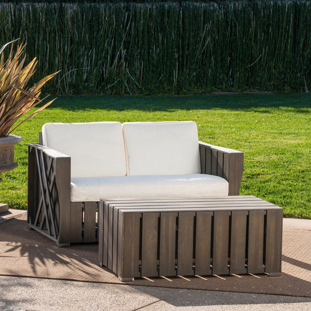 Cadence Outdoor 2-piece Acacia Wood Loveseat and Coffee Table Set with Cushions by Christopher Knight Home