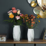 Contemporary ceramic table vase featuring a marble look design and geometric shape, ideal as a flower holder