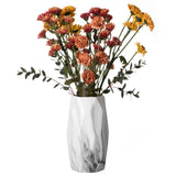 Contemporary ceramic table vase featuring a marble look design and geometric shape, ideal as a flower holder