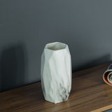Contemporary ceramic table vase featuring a marble look design and geometric shape, ideal as a flower holder