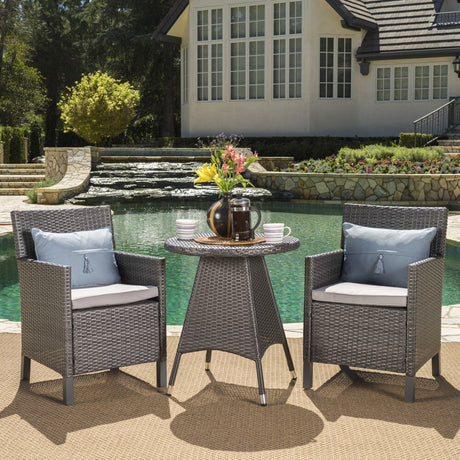 Cypress Outdoor 3-Piece Round Wicker Bistro Chat Set with Umbrella Hole & Cushions by Christopher Knight Home