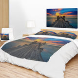 Designart 'Wide Wooden Bridge into Distant Sun' Pier Seascape Throw Blanket