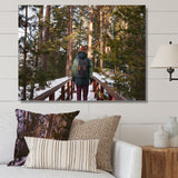 Designart "Hiking In Winter Forest" Forest Wall Art
