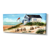 Designart "Small Bungalow On The Shore With Old Fence" Nautical & Coastal Canvas Wall Art Print