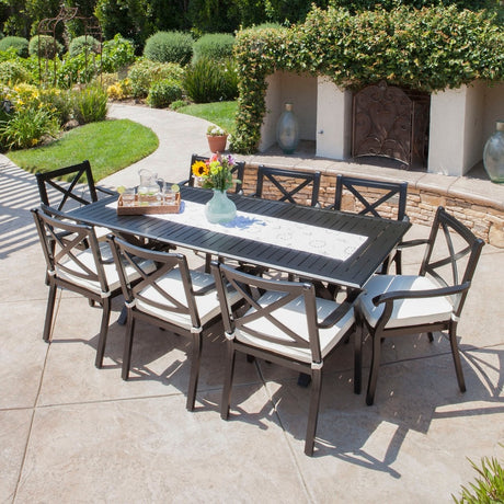 Exuma Outdoor Black Cast Aluminum Dining Set with Ivory Water Resistant Cushions by Christopher Knight Home