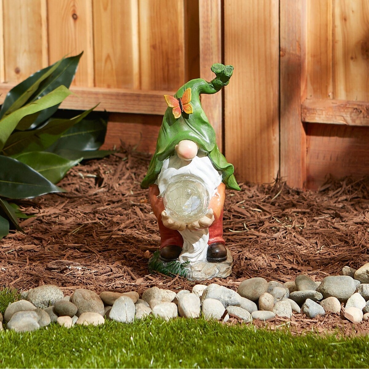 Gnome holding orb solar statue