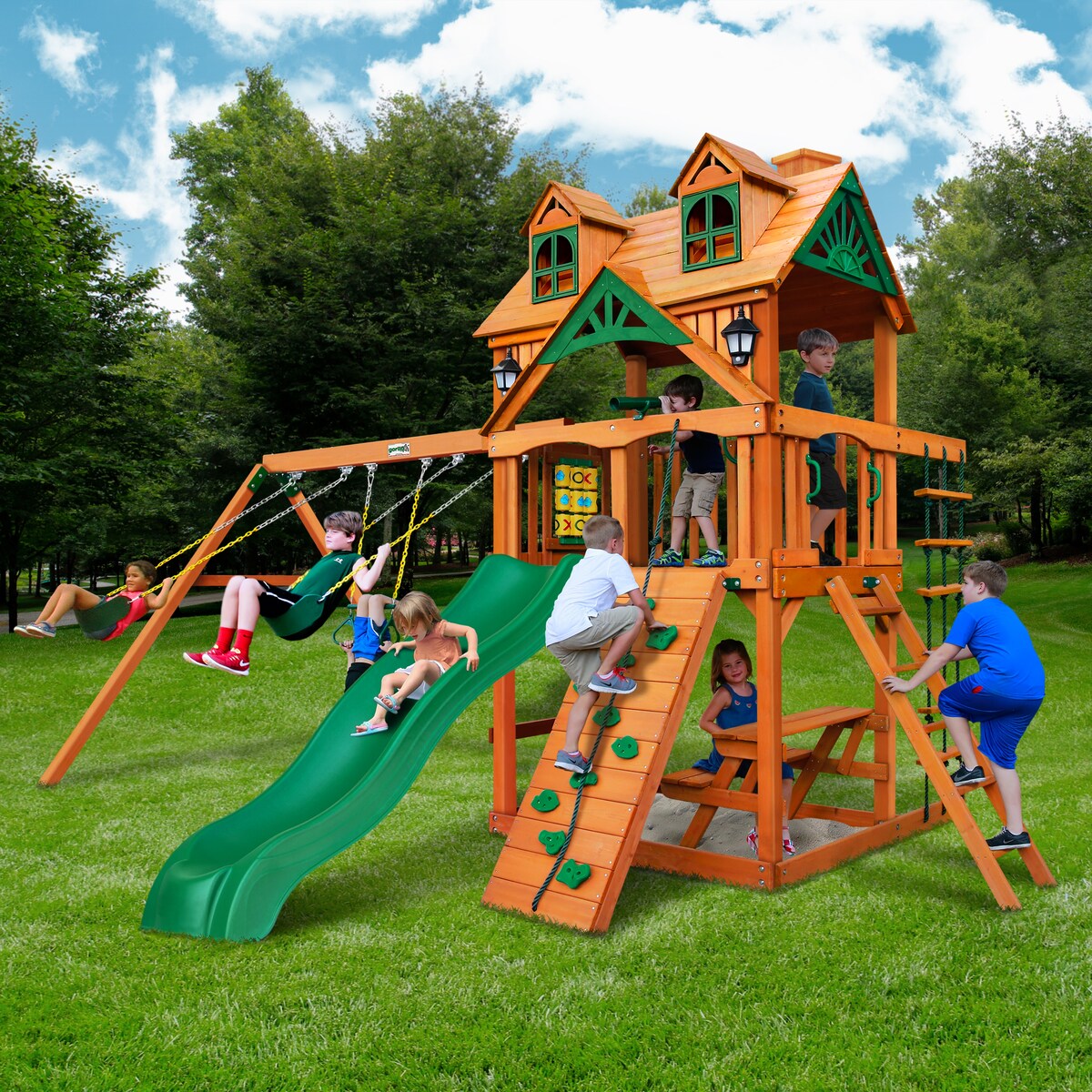 Gorilla Playsets Chateau Wood Swing Set with Malibu Roof, Rock Wall, and Built-In Picnic Table - Amber
