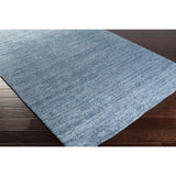 Hand-woven Dan Solid Viscose Area Rug