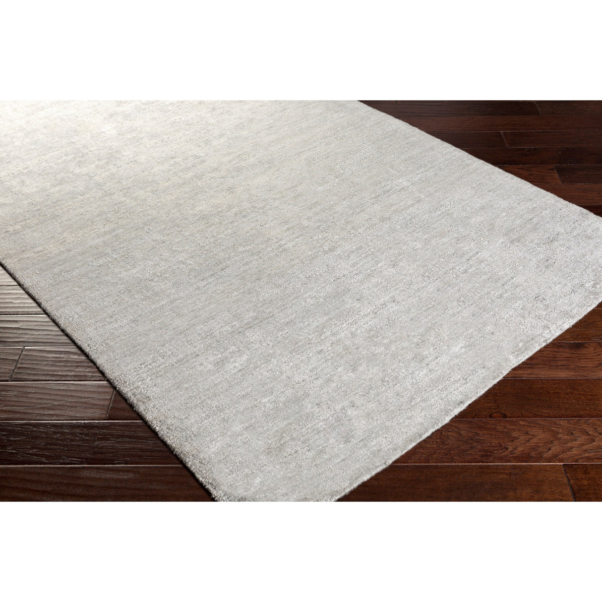 Hand-woven Dan Solid Viscose Area Rug