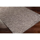 Hand-woven Dan Solid Viscose Area Rug