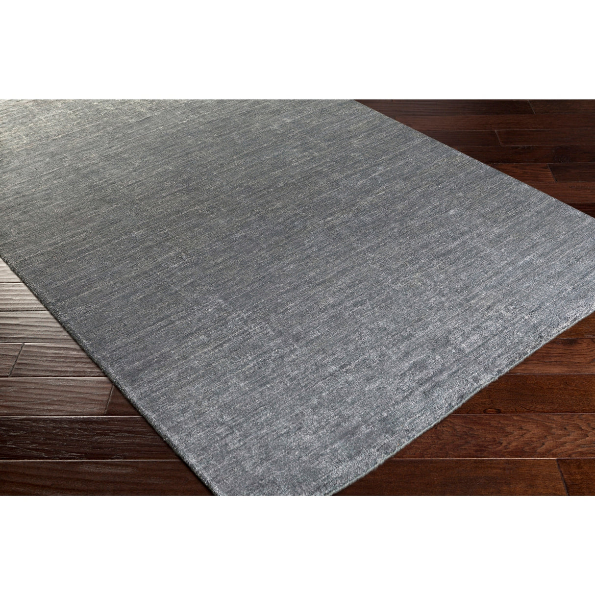 Hand-woven Dan Solid Viscose Area Rug